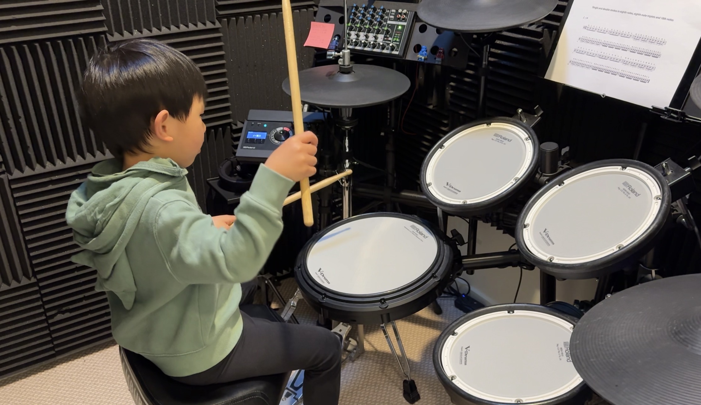 Student focused on a drum lesson at iDrum Academy